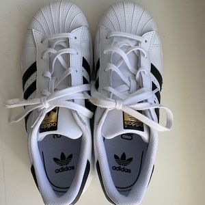 White Adidas and only worn one time